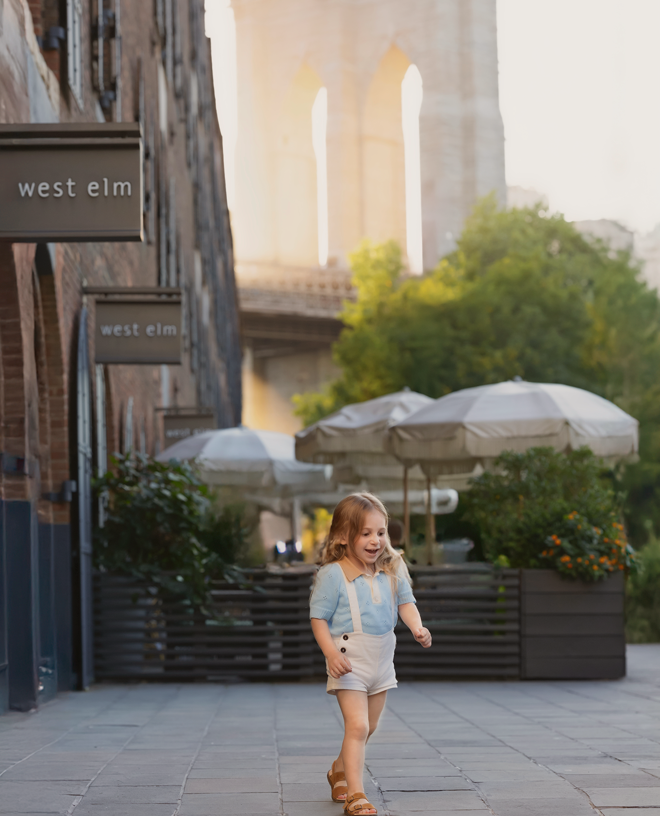 Child running near the Brooklyn Bridge
